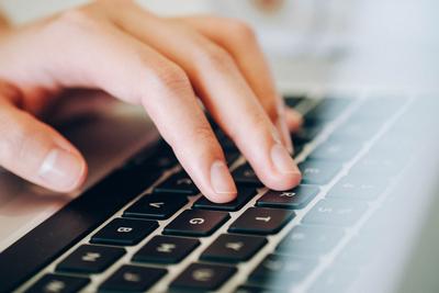 Hands typing on keyboard