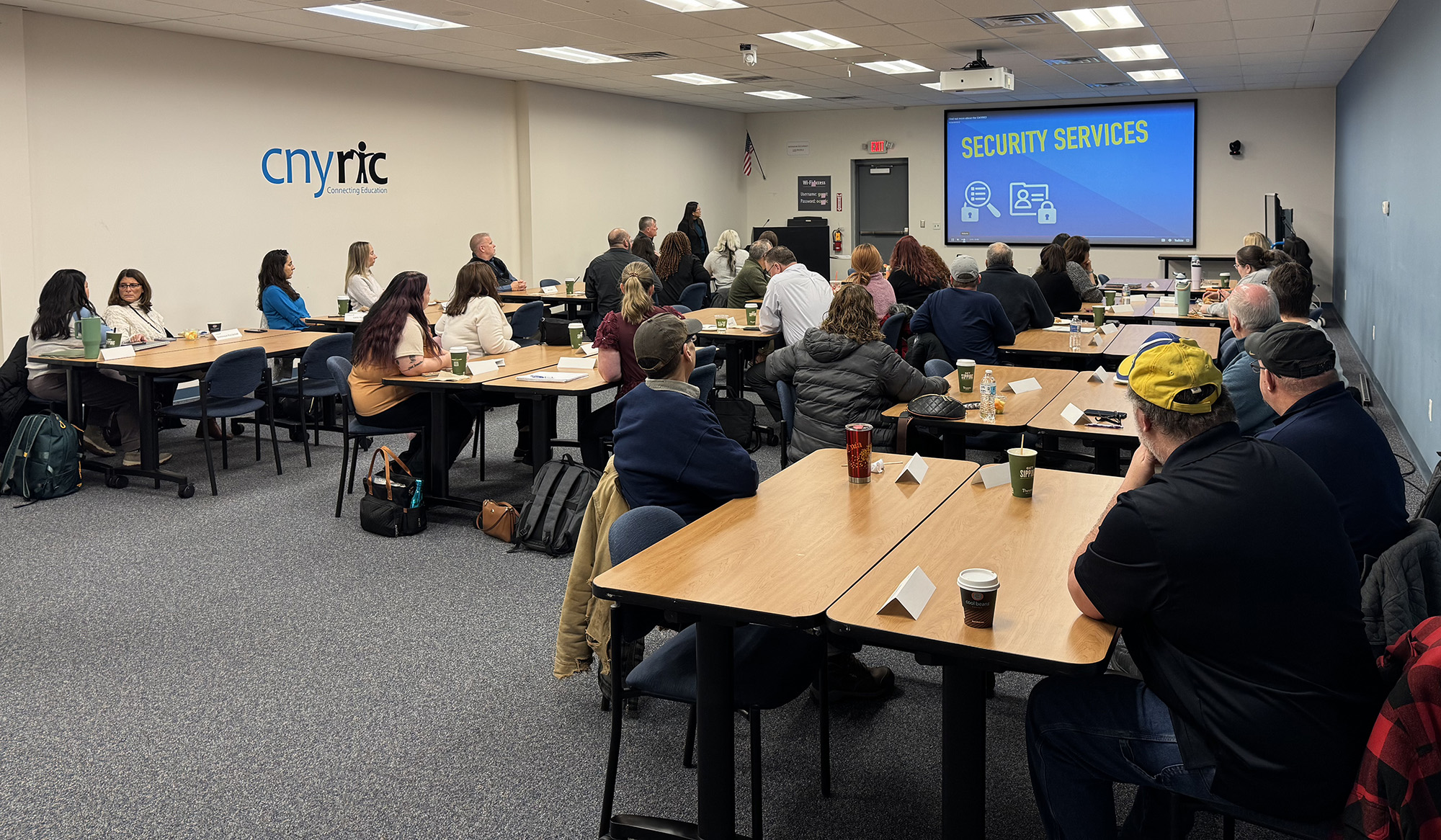 mentors gather with new employees for presentation