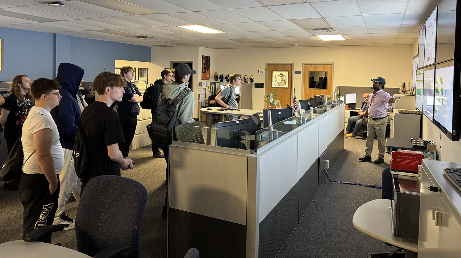 students visit the network operations center to learn more about service monitoring