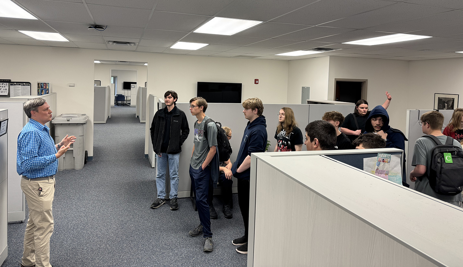 ben norris walks students through the eds office, where they learn more about the partnership between technology and data interpretation
