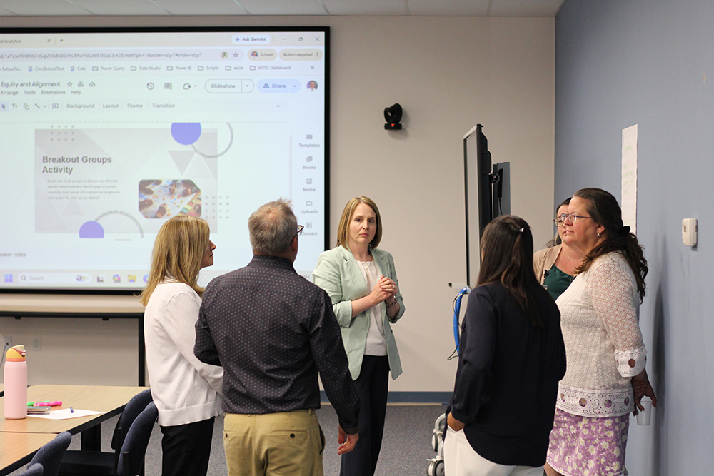 focus group attendees talk with cnyric team members about their reporting needs