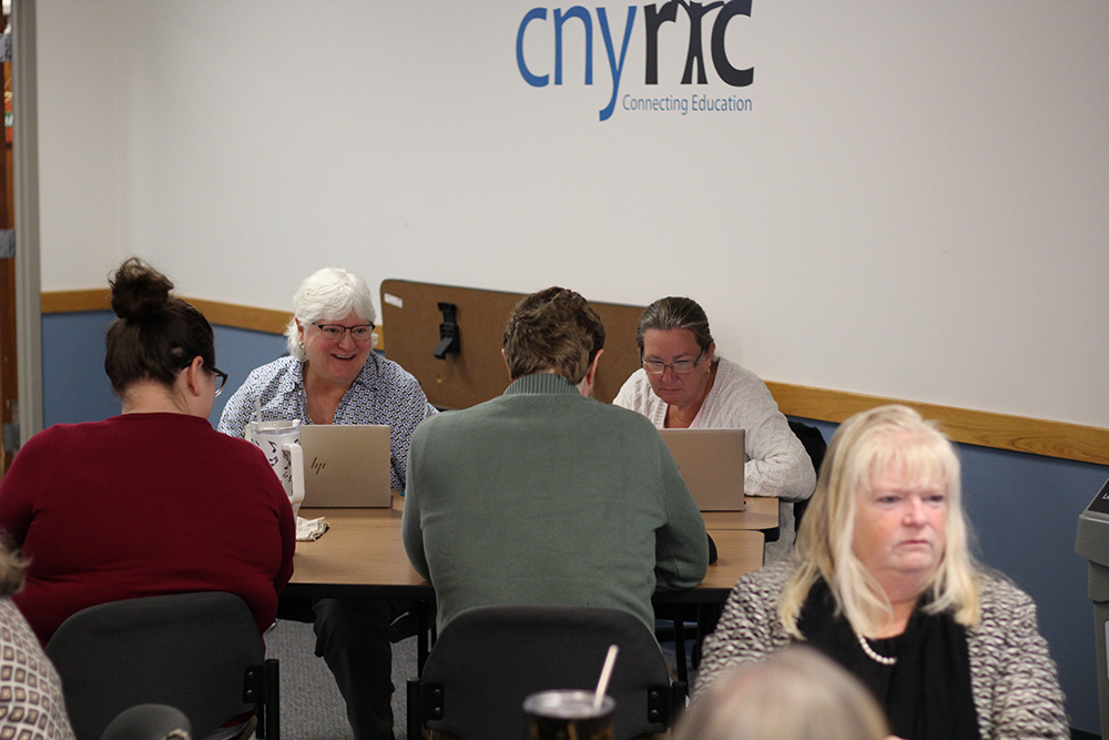 team members share a laugh during the morning's icebreaker