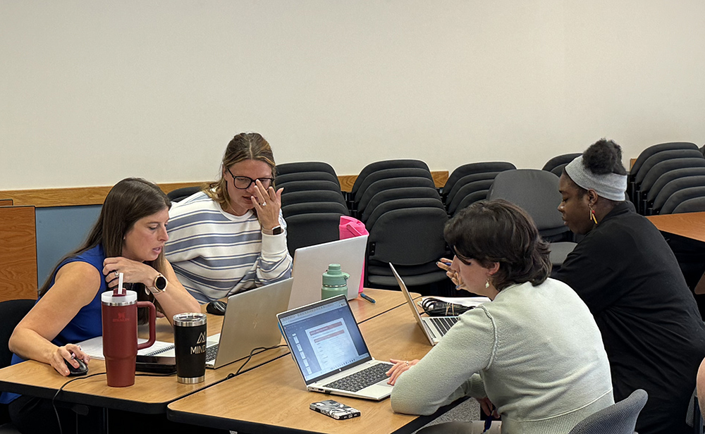 team members discuss questions posed by eds aministration