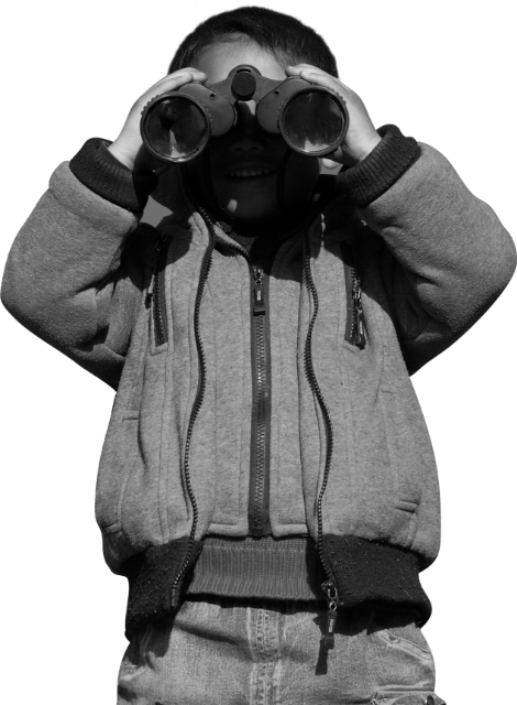 boy looking through binoculars